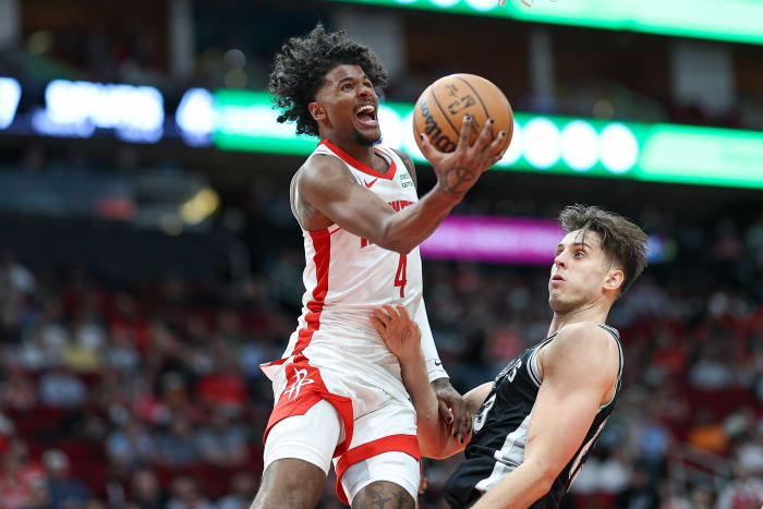 Rockets guard Jalen Green (4) shoots the ball as San Antonio Spurs forward Zach Collins (23) defends during the second half at Toyota Center.
